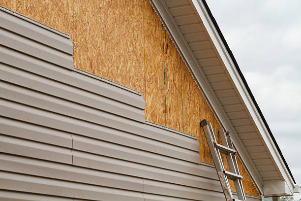 Professional Storm Damage Siding Repair technician working in Medway, OH